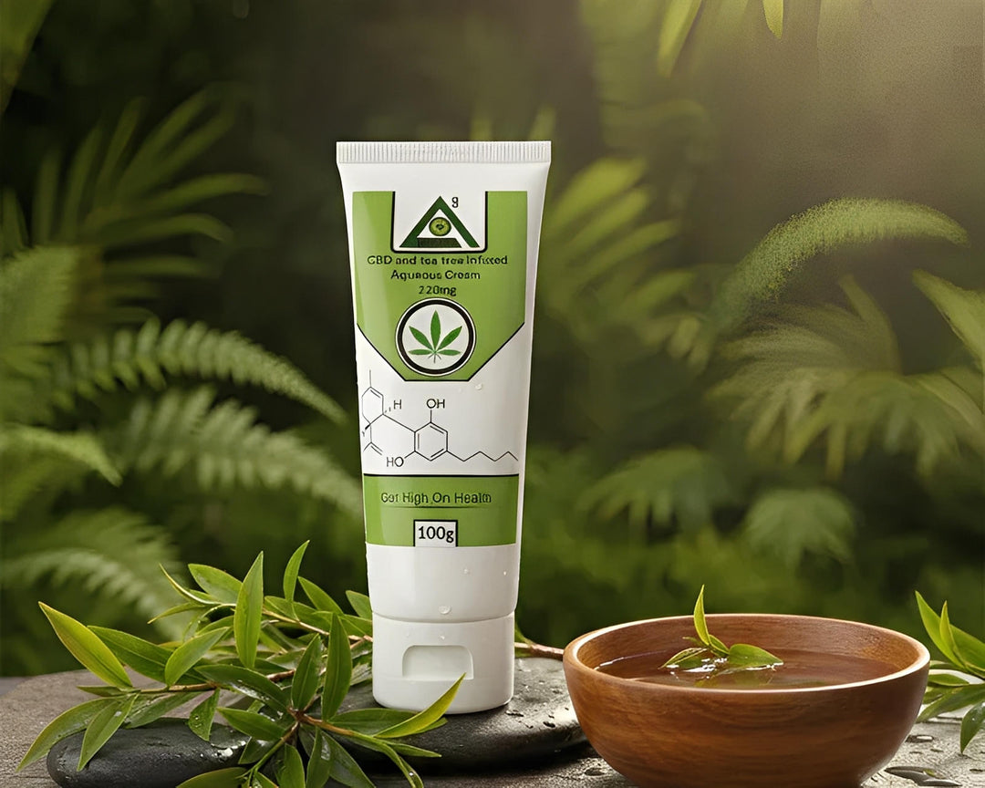 CBD tea tree infused cannabis cream tube with green leaves and wooden bowl, outdoors