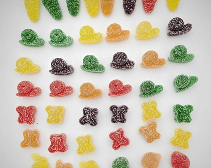 Assorted colorful gummy candies on a white plate