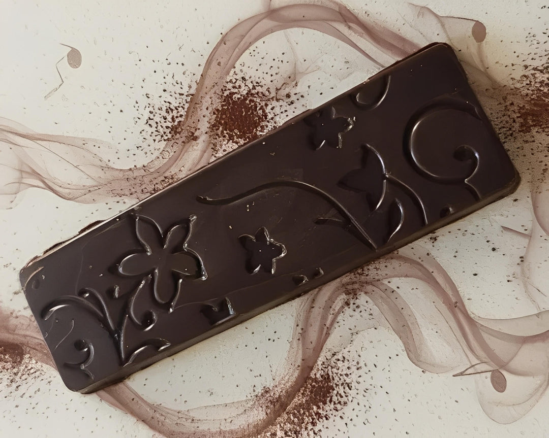 Dark chocolate slab with floral pattern on a decorative plate in Cape Town, South Africa