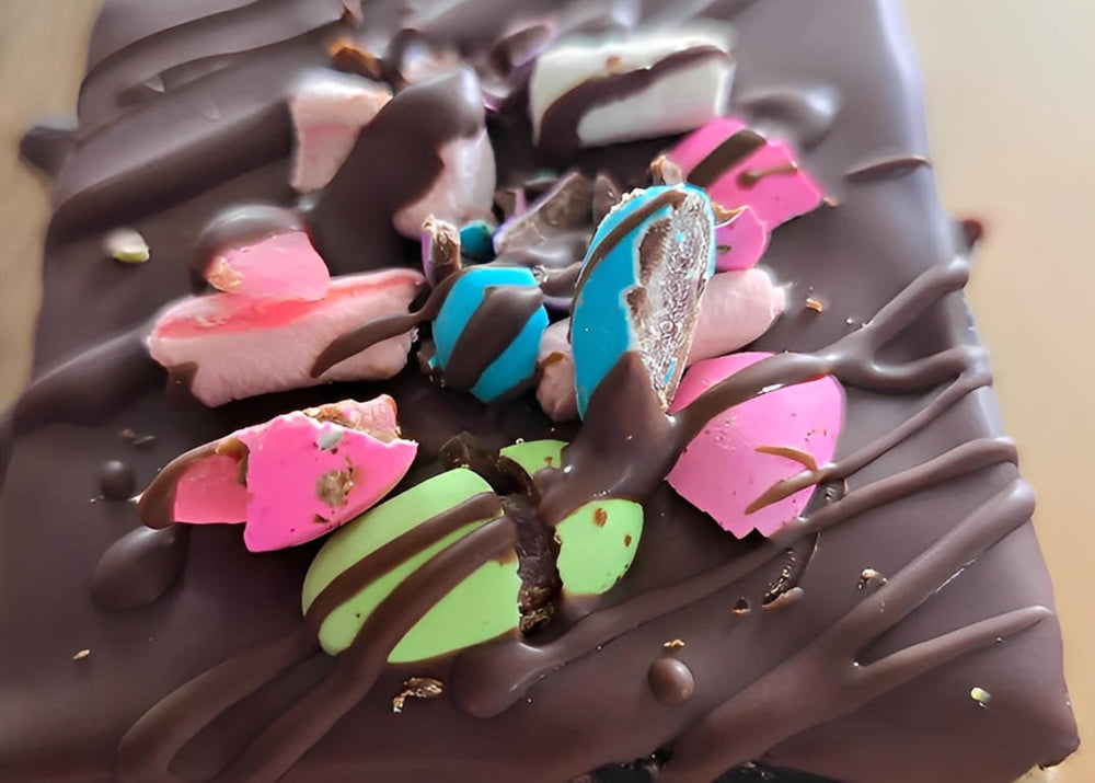 Chocolate dessert with colorful decorations on a wooden surface