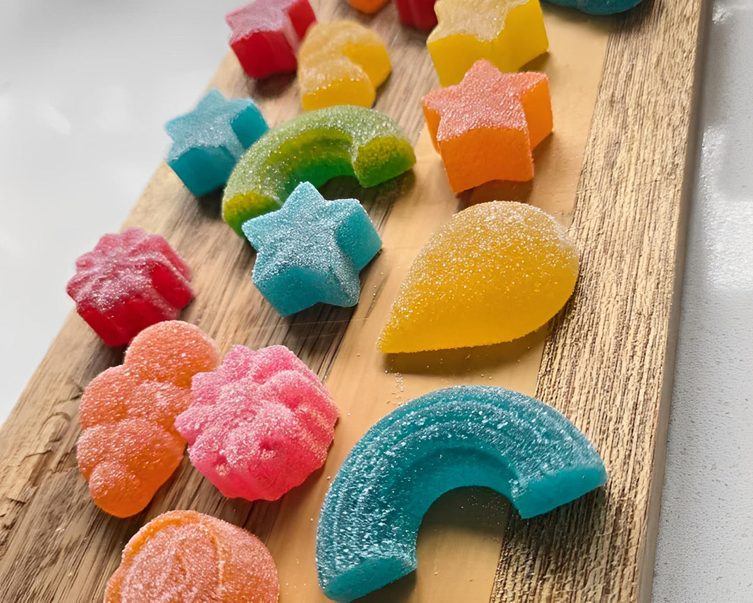 Colorful cannabis Yummie Gummies in fun shapes on a wooden board, Cape Town, South Africa