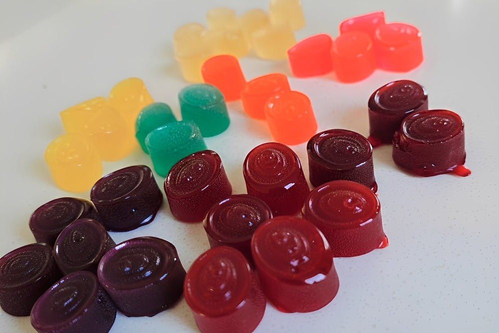 Assorted colorful gummy candies  on a white surface